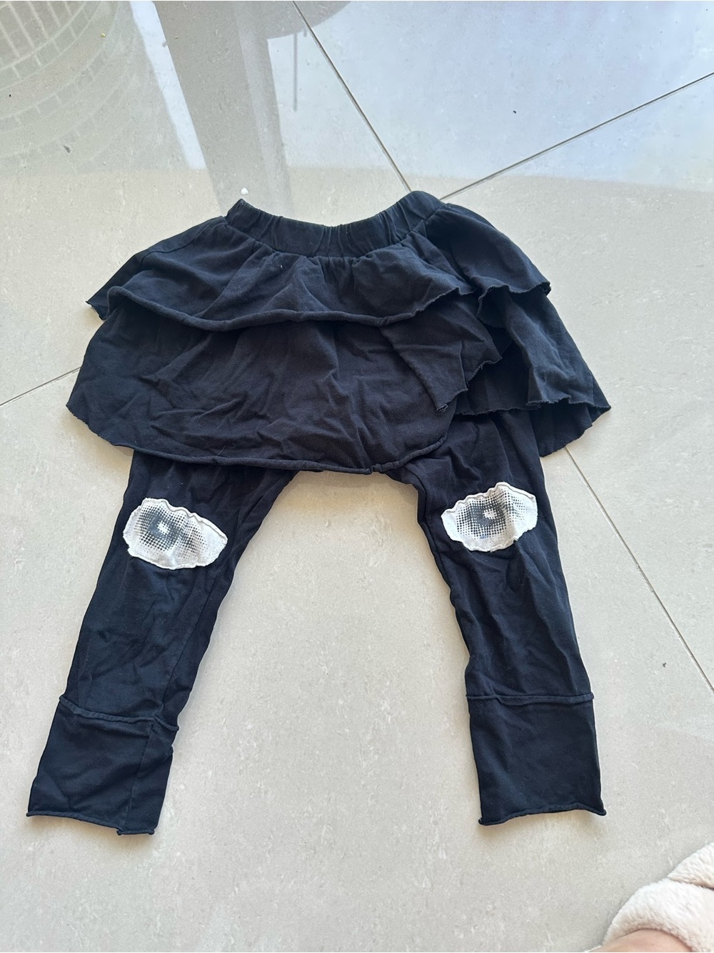 Nununu Black Ruffle Skirt Leggings with White Knee Patches